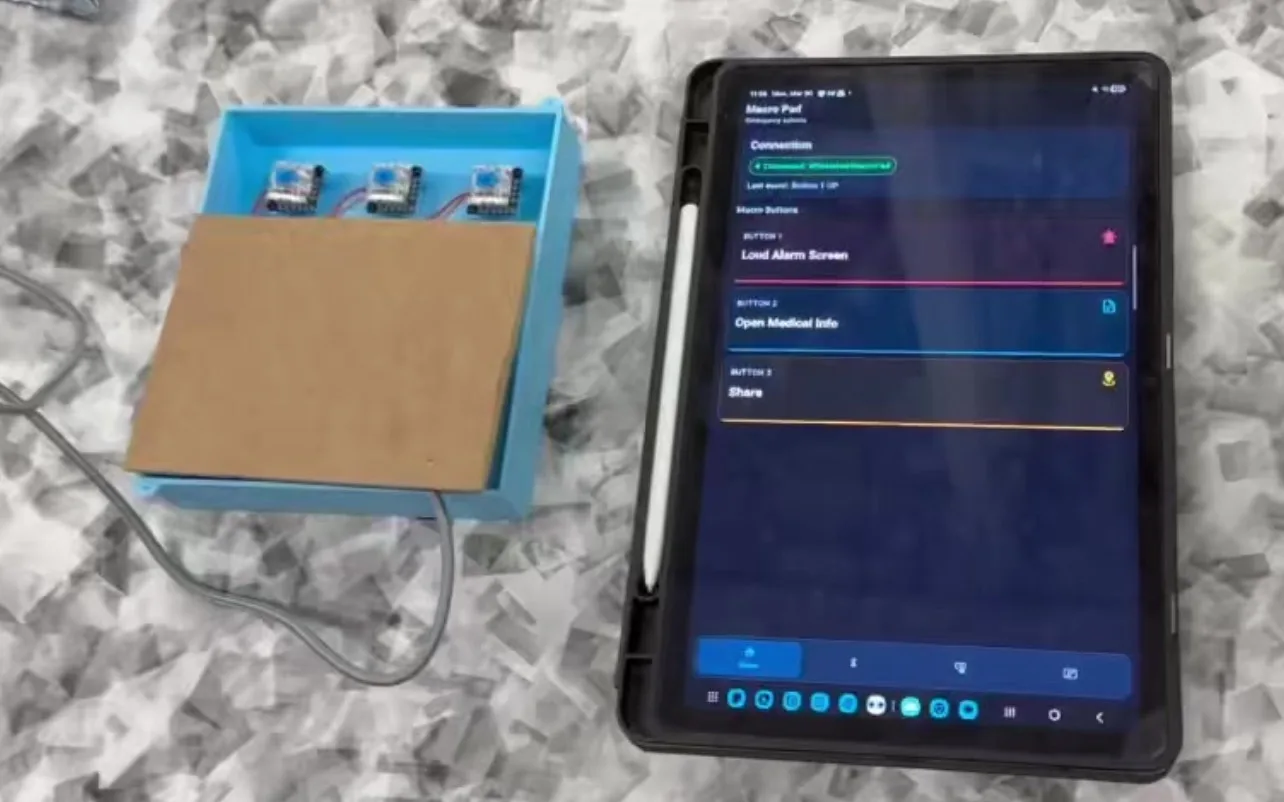 Accessible macro pad beside its companion Android application
